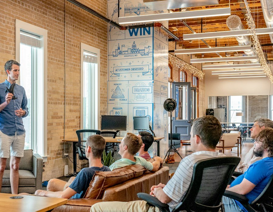 Team presenting a corporate website redesign in a meeting